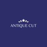 Antiquecut logo in white with a star and leaf design on a dark blue background